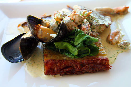 cockles & muscles served over potato cake