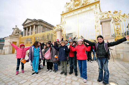 a group of young people at the palace at Versailles