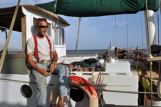 Robert Frederick Wilt, Jr. at his schooner Doubloon docked at the Kaunakakai wharf