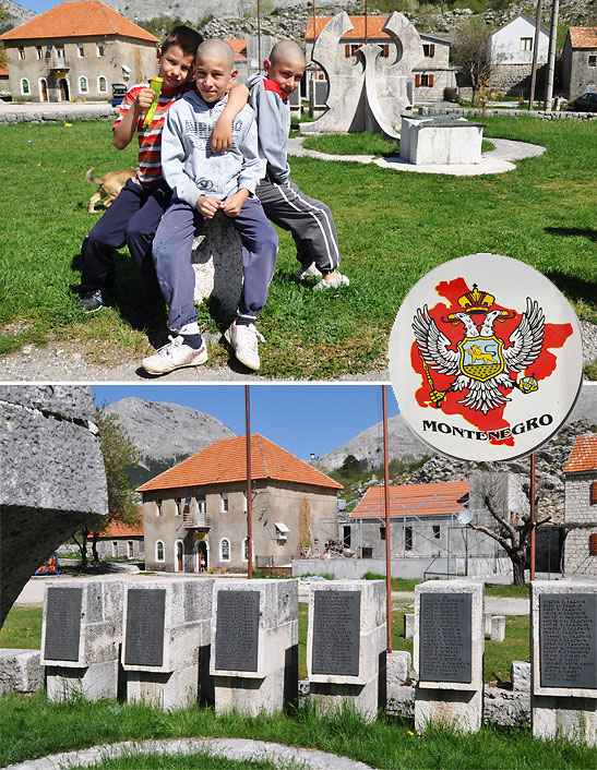 a group of boys in Njeguski with monument in the background; names of villagers killed in previous wars behind the monument