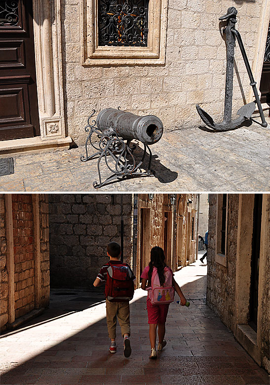 medieval cannon in front of Kotor's Maritime Museum; children returning home from school in Kotor