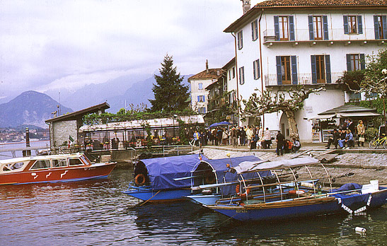 boats moored by the pier at Isola Pescatori, Northern Italy