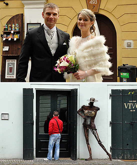 a newly wed couple and red-shirted tourist beside a Don Quixote sculpture