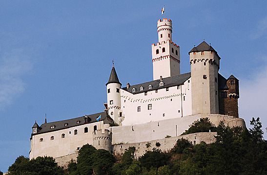 one of the castles along the Rhine River as seen from a river cruise