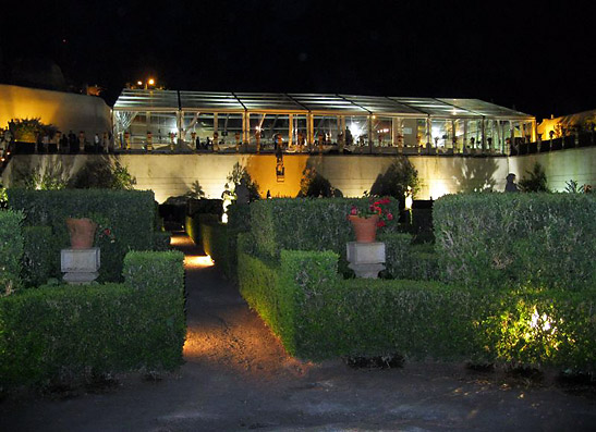 the glass-roofed ballroom of Jardim do Pao viewed from the formal gardens