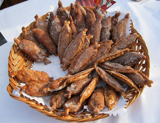 a basket of Sardinhas Doces de Trancoso, little sardine-shaped pastries