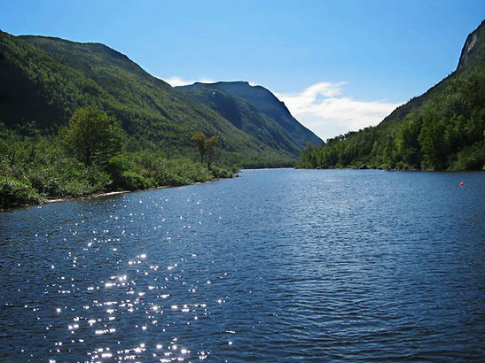 sunlight sparling on the waters of a lake at Parc National des Hautes-Gorges-de-la-Rivere-Malbaie