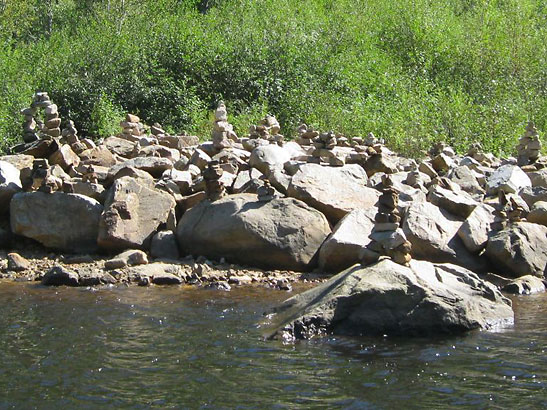 Inuit stone cairns on a river shore, Parc National des Hautes-Gorges-de-la-Rivière-Malbaie