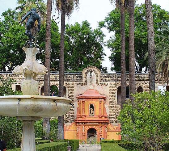view of the palace through the gardens at Alcazar
