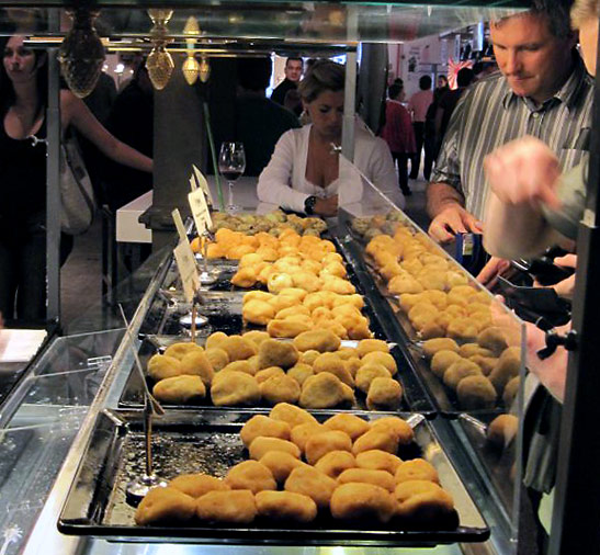 a selection of ham, cod and shrimp croquets at a tapas stall at the Mercado de San Miguel, Madrid