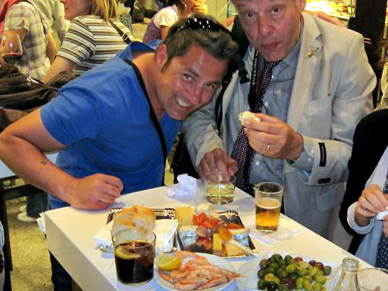 the writer's friends dining at one of the stalls inside the Mercado de San Miguel, Madrid