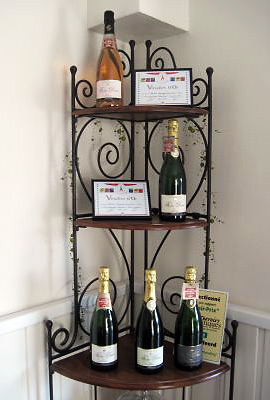 a display of Fresne Champagne and their awards