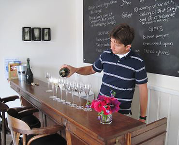 Pierre Fresne pouring champagne