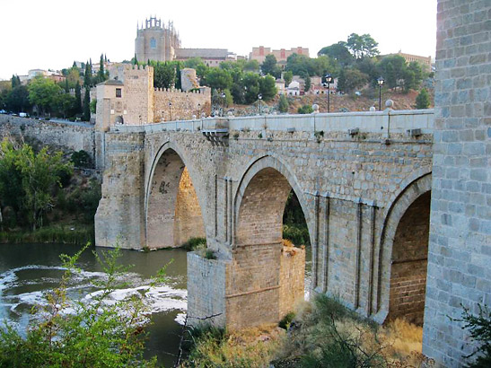 ancient stone bridge leading to the city of Toledo, Spain