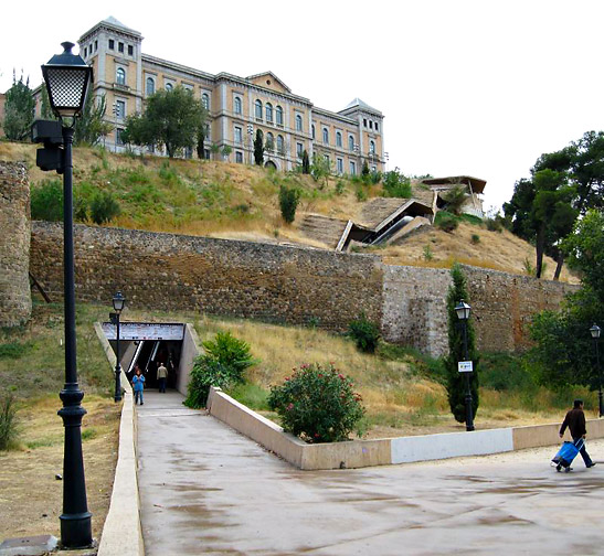 view of one of the escalators running through the ancient walls of Toledo