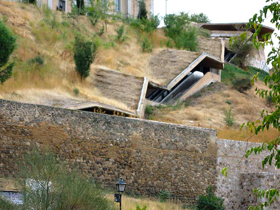 closeup of the angled escalator at Toledo's ancient walls