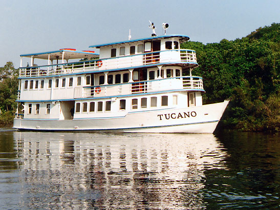 the 16-passenger river yacht Tucano cruising along the Amazon