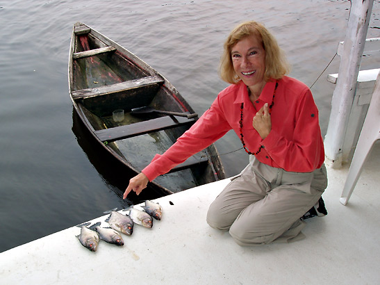 writer with piranhas she had just caught