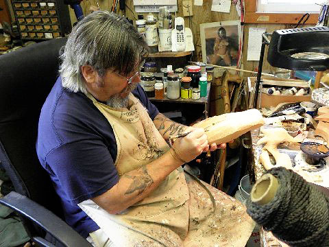 carver Roe Terry working on a decorative decoy