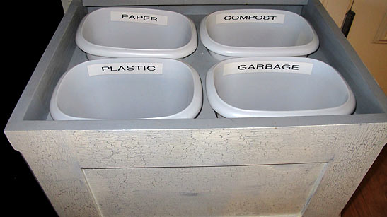 recycling trash bin is divided into four units