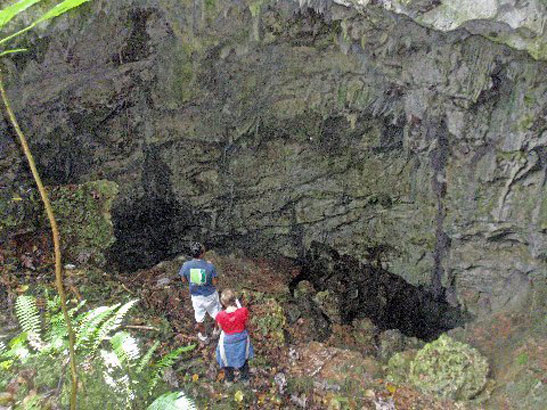 hikers exploring a cave in Choco National Park, Puerto Plata, Dominican Republic