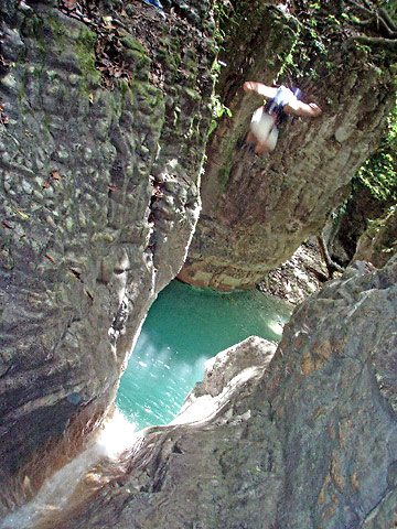 another tourist diving into one of the 27 pools