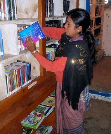 a READ-trained librarian at a READ library in a Nepali village