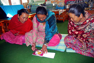 Nepali women studying a recipe in Jomsom