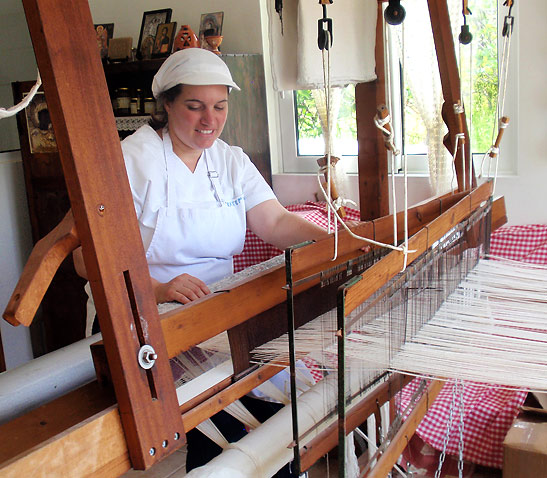 weaving on a loom at the Appolonia Bakery