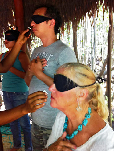 blindfolded tourists smelling oil