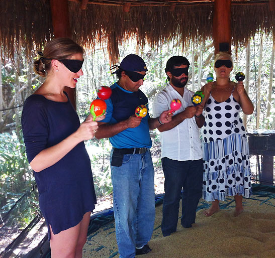 blindfolded guests with maracas