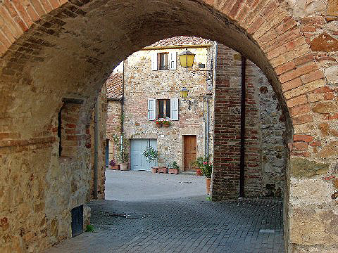 an archway to the small Etruscan town of Murlo, Tuscany