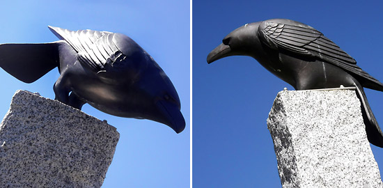 two raven sculptures on concrete pedestals at Banff's Heritage Square
