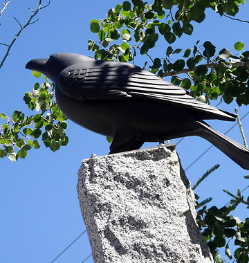another raven sculpture at at Banff's Heritage Square