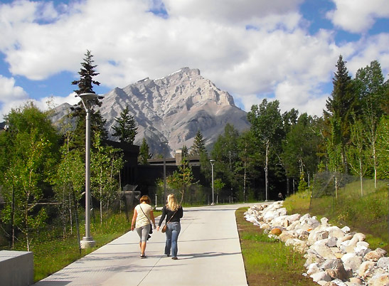 walkway inside the Banff Centre with mountain peak in the background