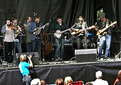 musicians doing a workshop onstage at the Calgary Folk Fest