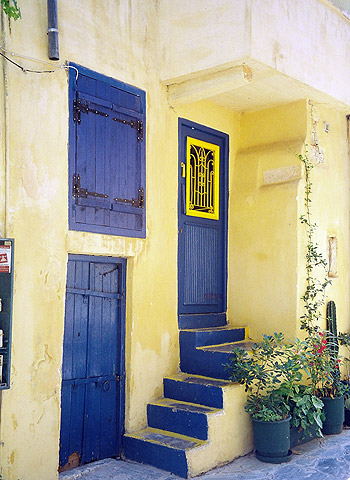 bright blue-colored doors and windows of a house in Chania, Crete