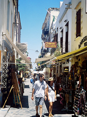 tourists strolling through one of Chania's numerous shopping alleys