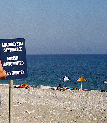 sign on a beach prohibiting nudism in Chania