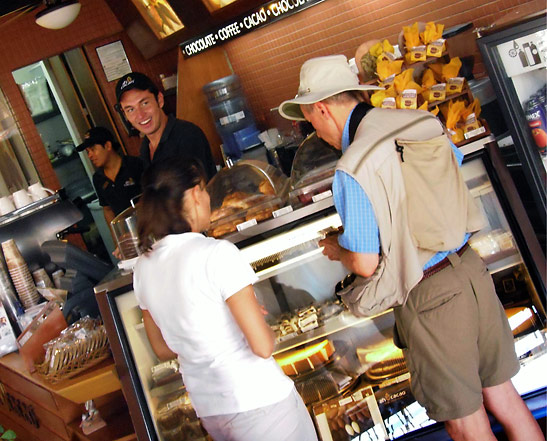proprietor Monica Tello orienting a customer at the Ah Cacao, a chocolate and coffee store, Playa del Carmen