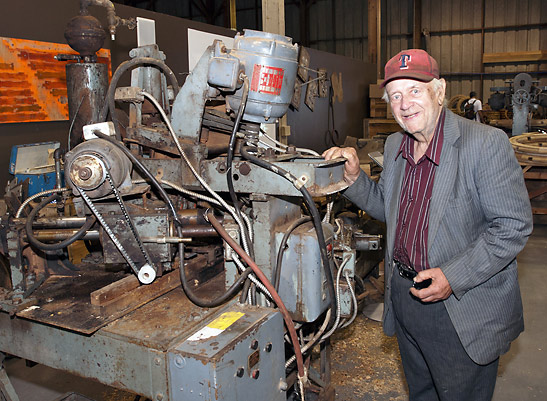 Jack Lubzinski with the first machine he designed and built