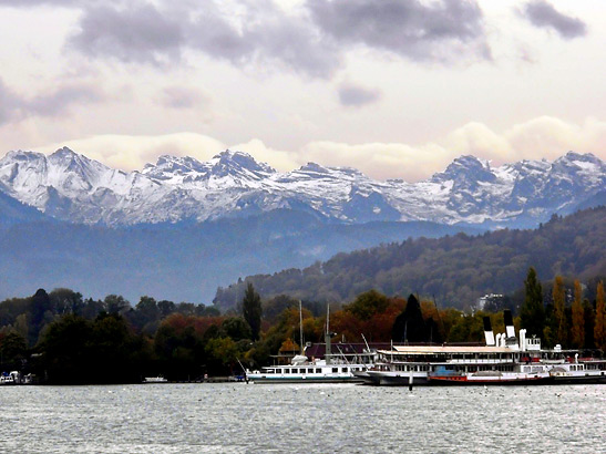 wharf in Lucerne with the Swiss Alps in the background