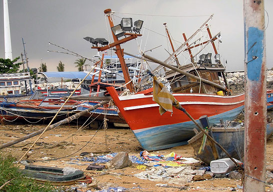 wrecked fishing boats and debris at Baan Amphoe Beach