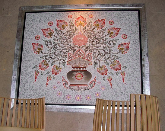 artwork with a lotus theme on wall of Siam Kempinski Hotel