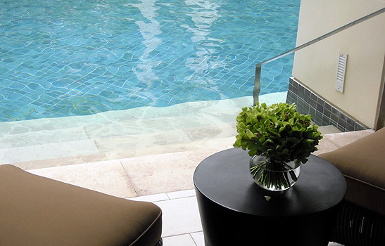 view of the pool from one of the swim-up rooms at the Siam Kempinski