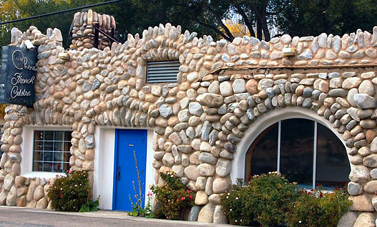 Le Chene French Cuisine restaurant's castle-like structure made of river rock