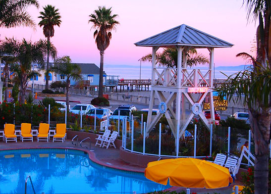 wooden tower and heated pool at Avila Lighthouse Suites with the pier in the background