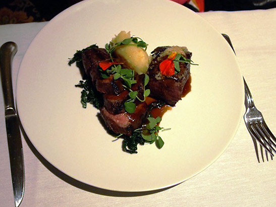 prime sirloin cap with braised greens, crushed potatoes, bone marrow crust and bordelaise: one of the dishes served at the Gardens of Avila Restaurant