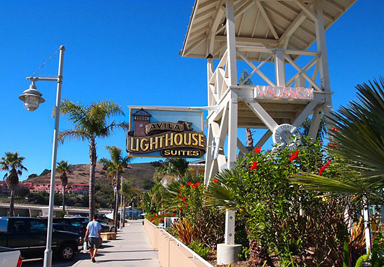 wooden tower and signboard at the Avila Lighthouse Suites