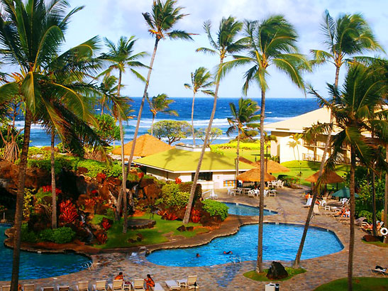 Kauai Beach Resort with its rows of palm trees, Hawaiian gardens and swimming pools